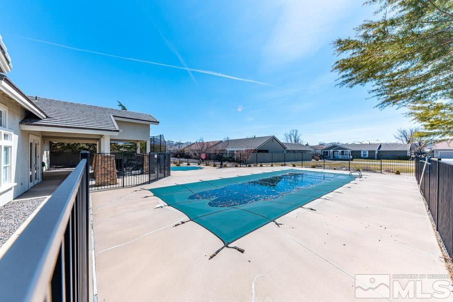 1487 Wild Wolf Way Reno, NV 89521 - Photo 37 of 39 a view of a swimming pool with lounge chair