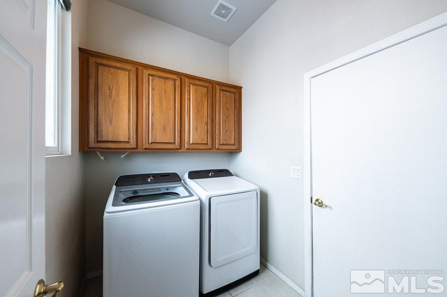 1487 Wild Wolf Way Reno, NV 89521 - Photo 39 of 39 a utility room with dryer and washer