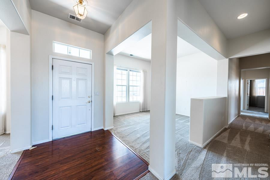 1487 Wild Wolf Way Reno, NV 89521 - Photo 10 of 39 wooden floor in an empty room with a window