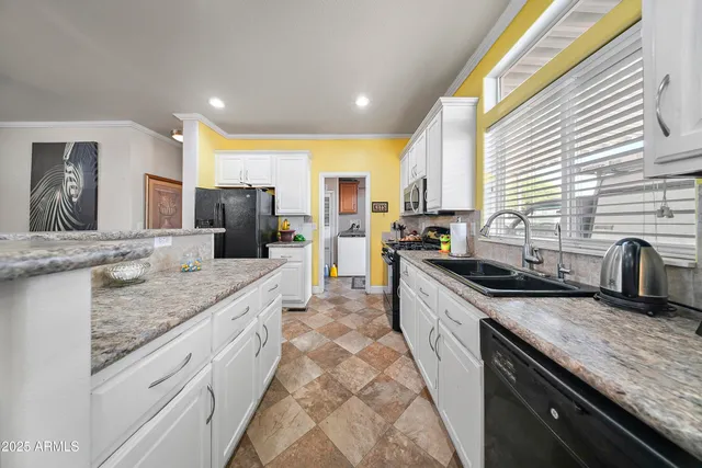 a view of a hallway with washer and dryer