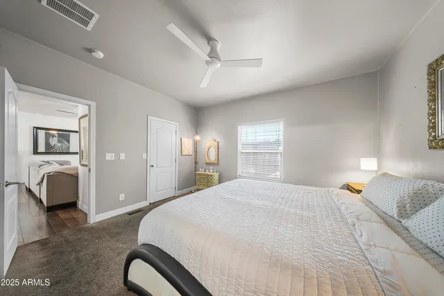 a bathroom with a granite countertop sink a mirror a bathtub and shower