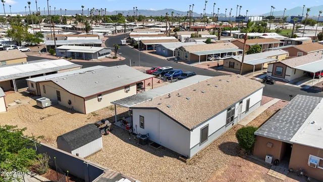 an aerial view of a houses with city view