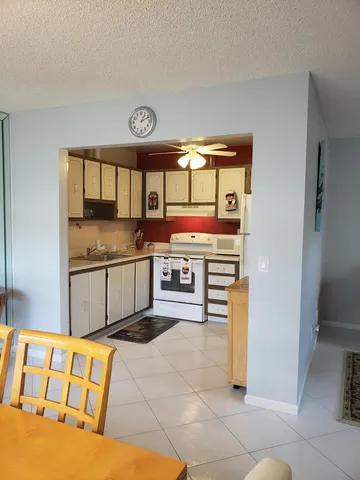 a kitchen with stainless steel appliances granite countertop a stove and a sink
