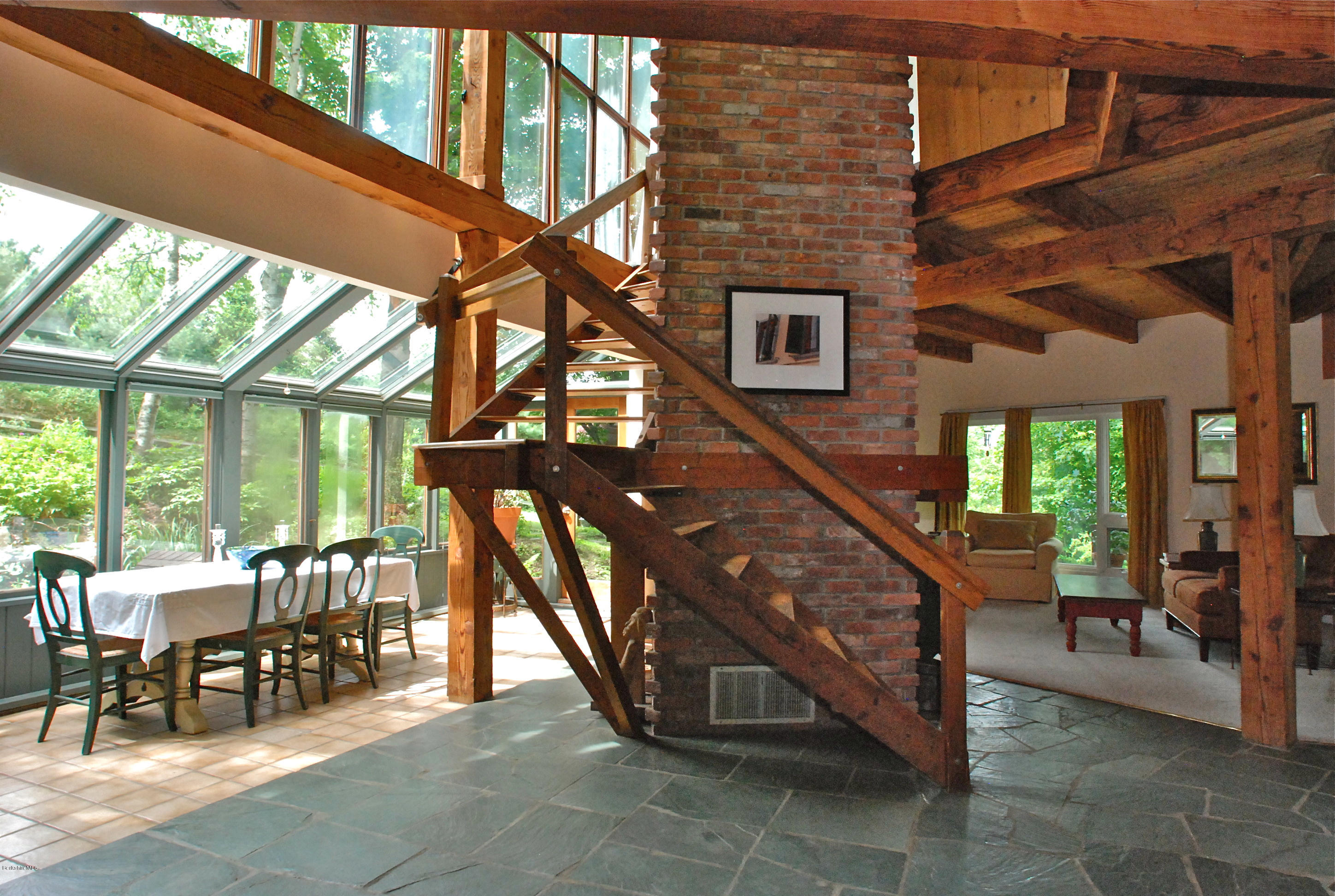77 Lenox Road West Stockbridge, MA 01266 - Photo 4 of 40 a view of a patio with a table and chairs