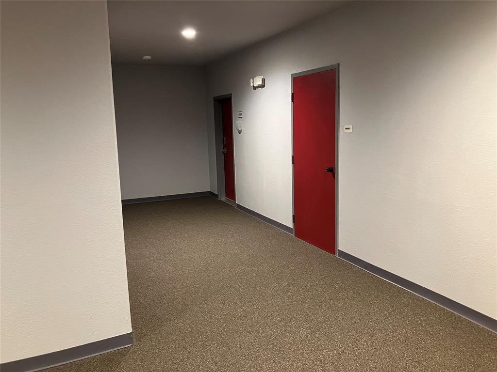1220 West Trinity Mills Road, Unit 5009 Carrollton, TX 75006 - Photo 19 of 25 an empty room with a natural light