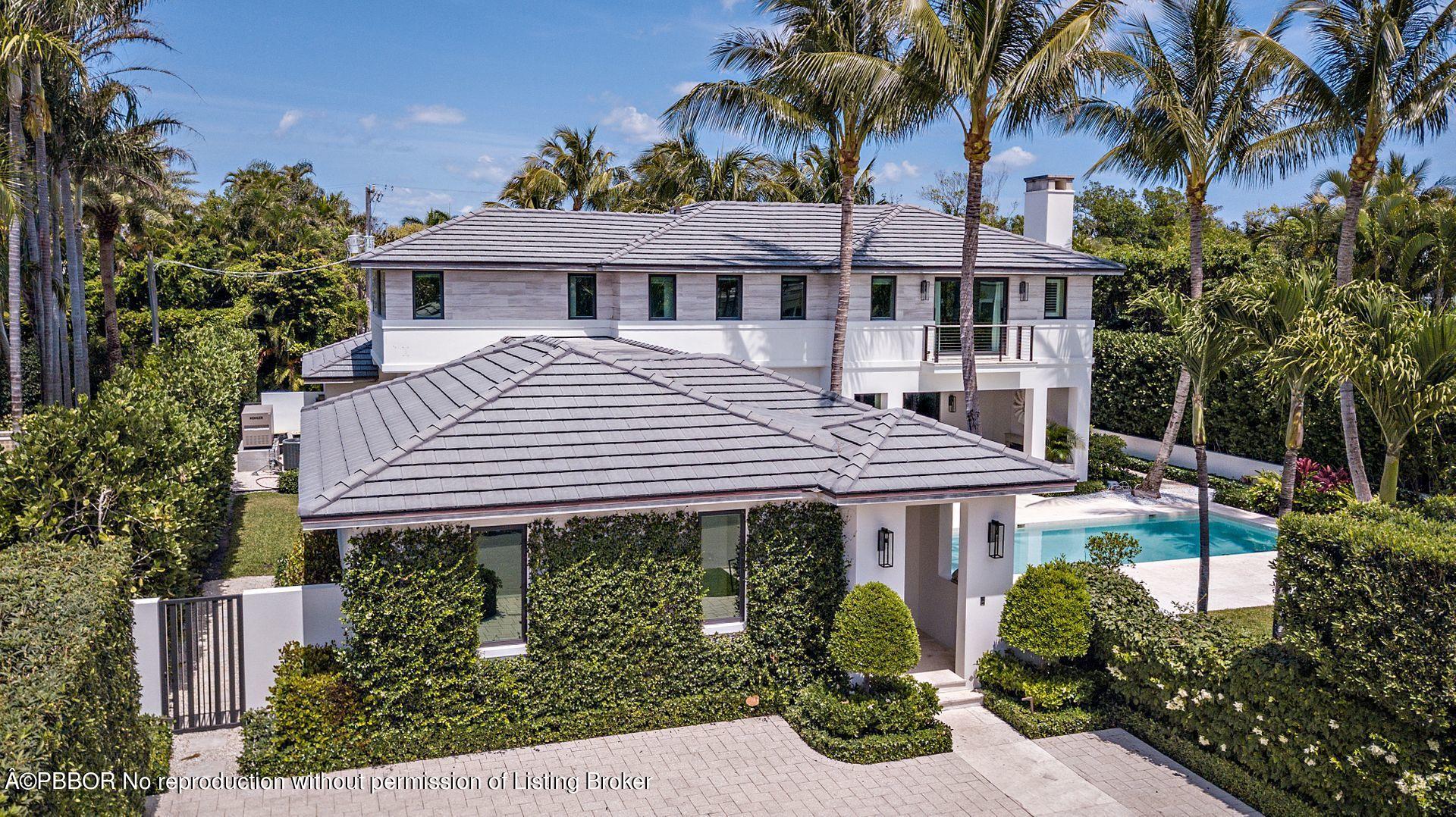 325 Garden Road Palm Beach, FL 33480 - Photo 2 of 57 a view of a house with a garden and plants
