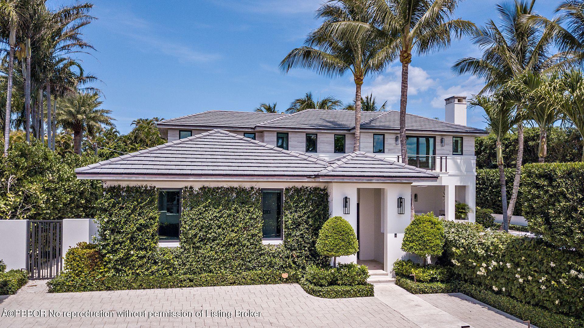 325 Garden Road Palm Beach, FL 33480 - Photo 11 of 57 a front view of a house with a yard