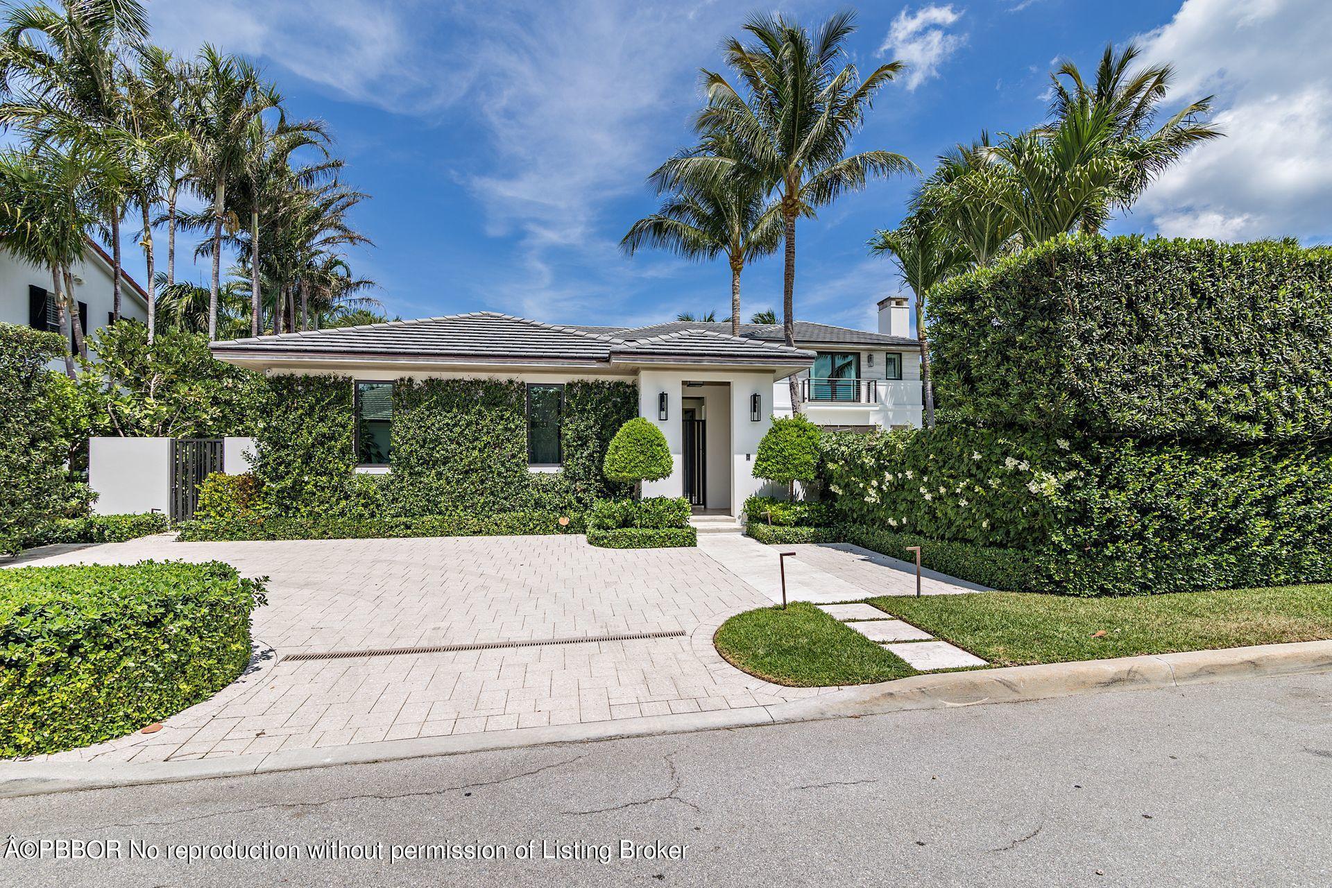 325 Garden Road Palm Beach, FL 33480 - Photo 12 of 57 a view of a house with a yard and potted plants