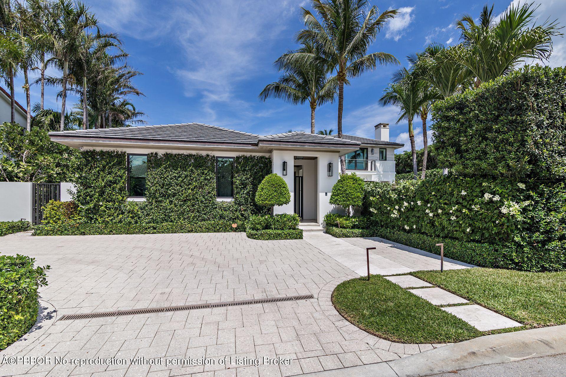 325 Garden Road Palm Beach, FL 33480 - Photo 13 of 57 a view of a house with a yard and potted plants