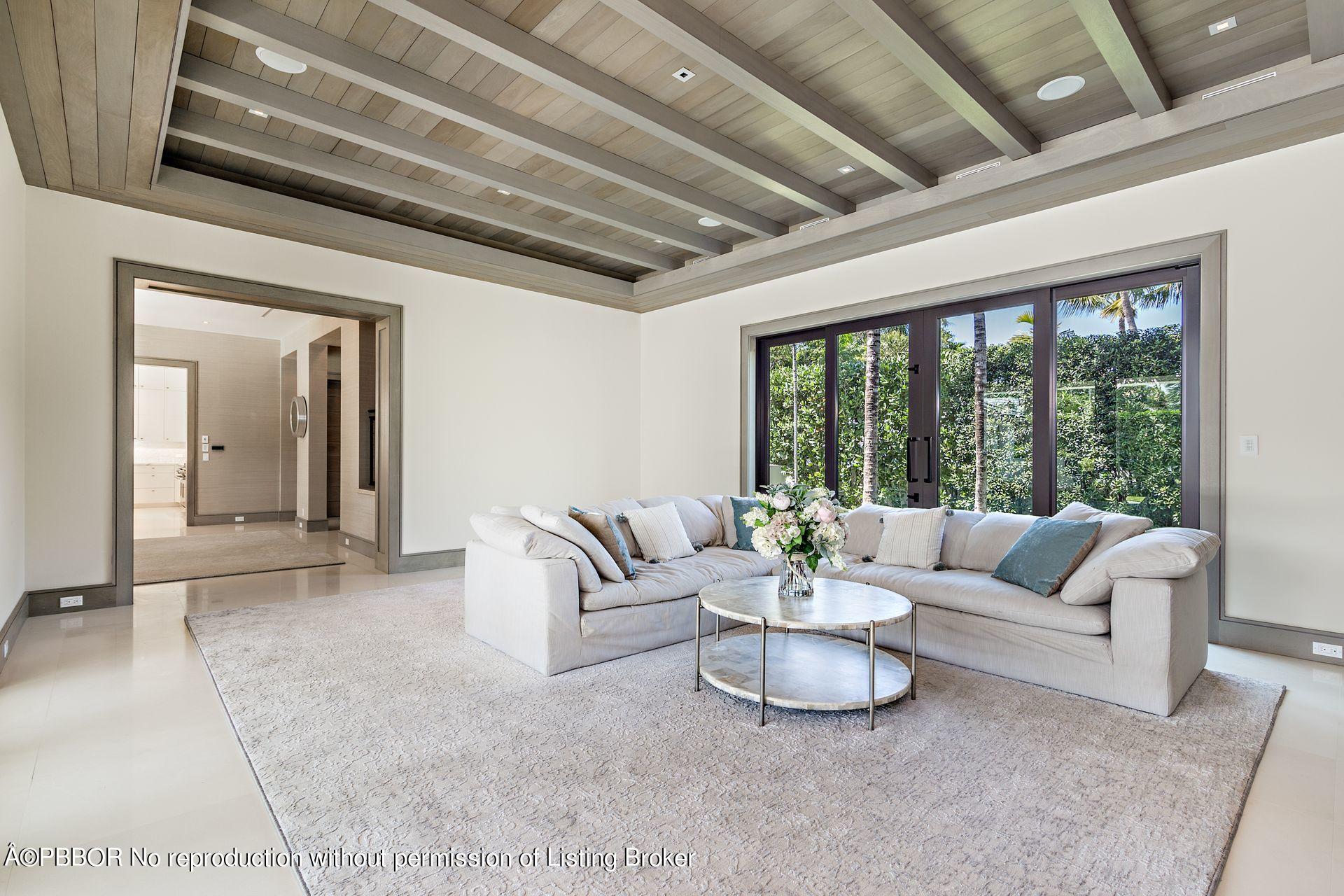 325 Garden Road Palm Beach, FL 33480 - Photo 16 of 57 a living room with furniture and a large window