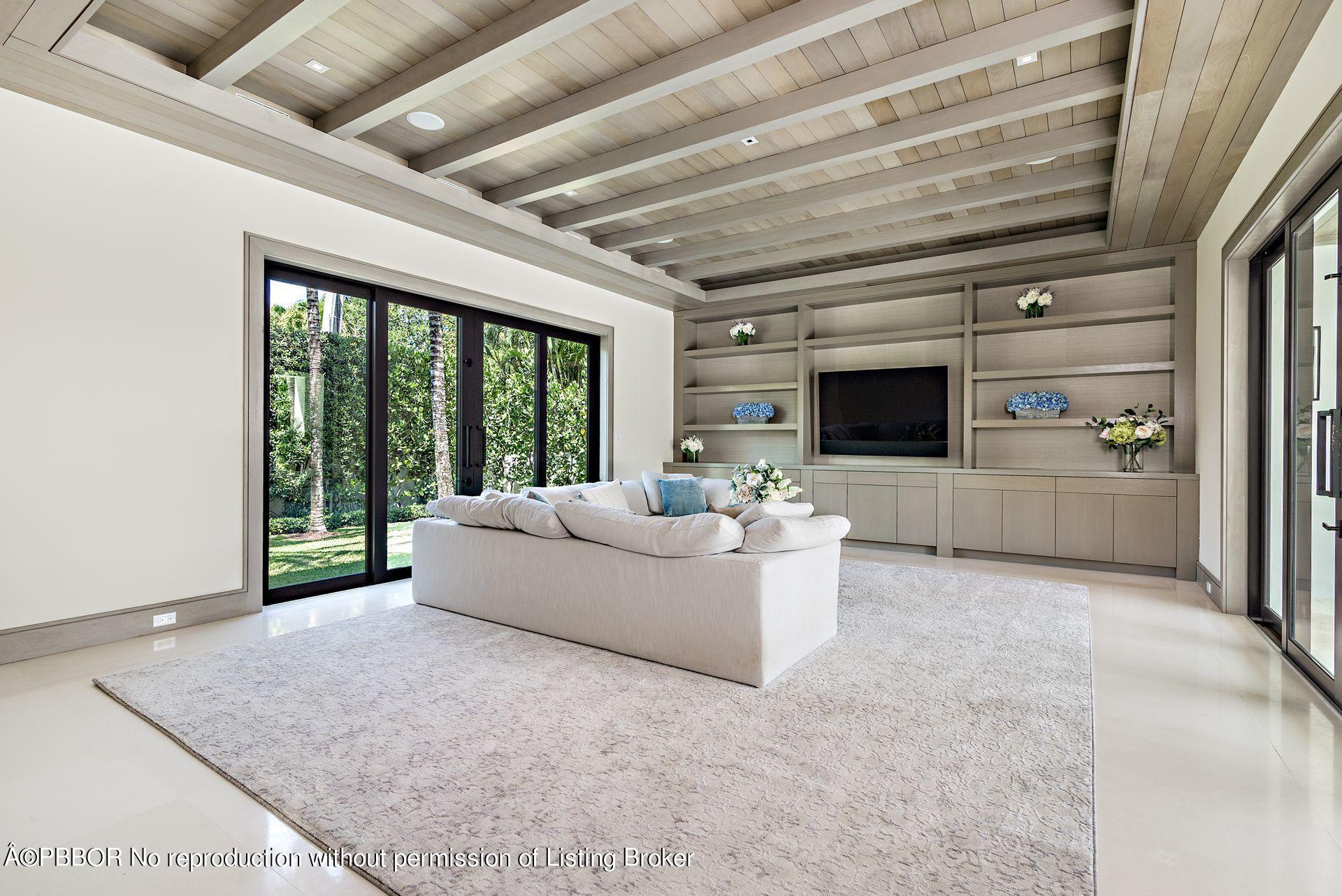 325 Garden Road Palm Beach, FL 33480 - Photo 18 of 57 a living room with furniture and a flat screen tv