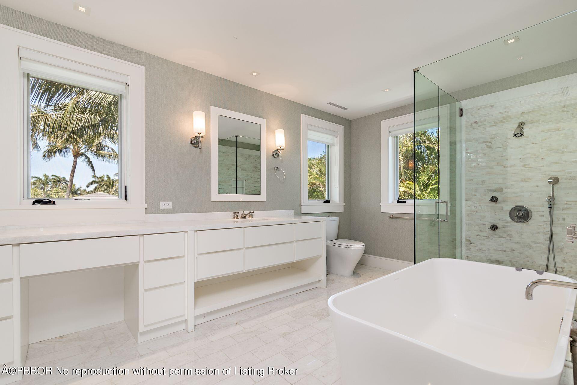 325 Garden Road Palm Beach, FL 33480 - Photo 29 of 57 a spacious bathroom with sink shower and bathtub