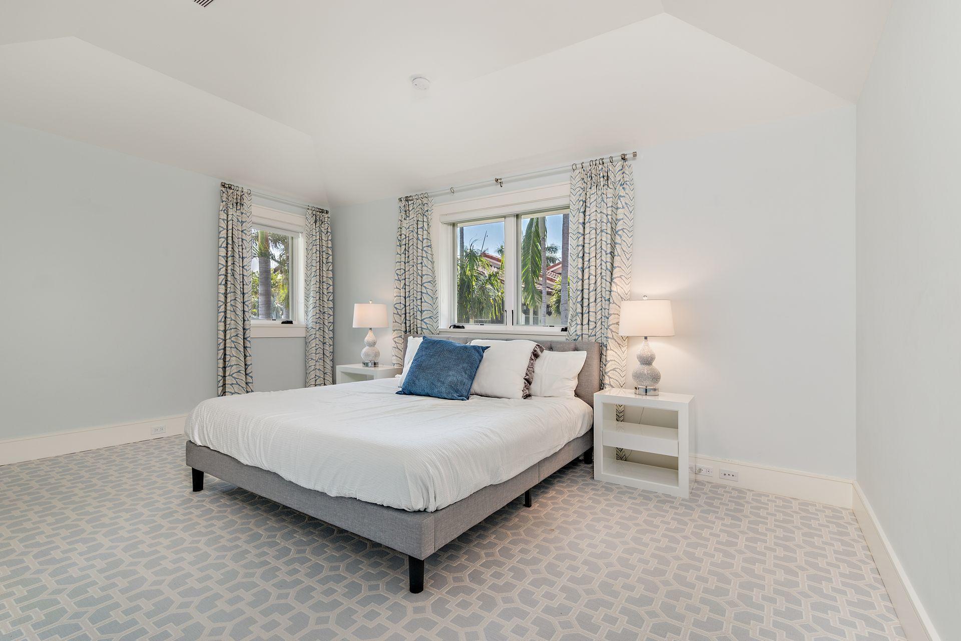 325 Garden Road Palm Beach, FL 33480 - Photo 34 of 57 a bedroom with a bed and window