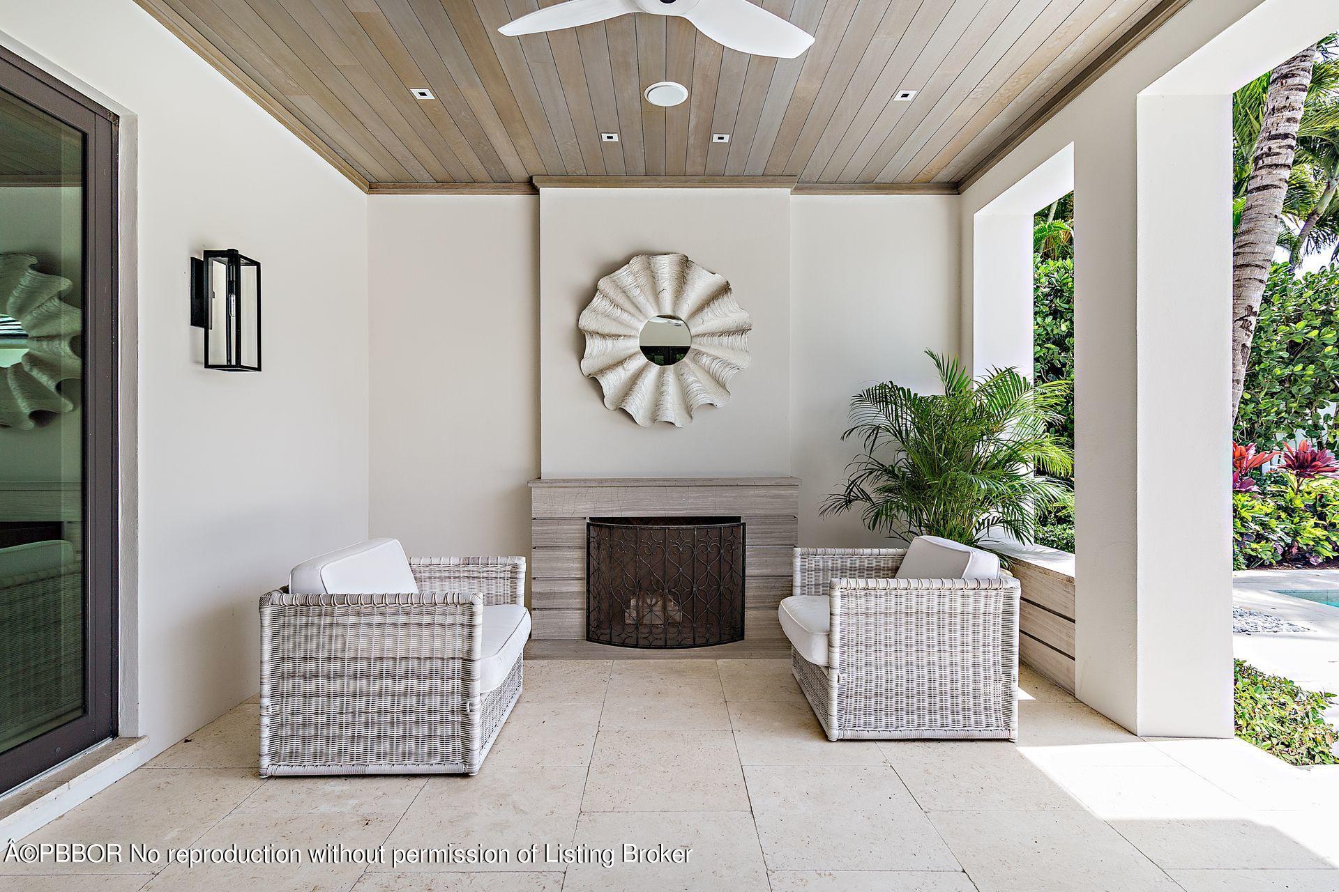 325 Garden Road Palm Beach, FL 33480 - Photo 39 of 57 a living room with furniture and a potted plant