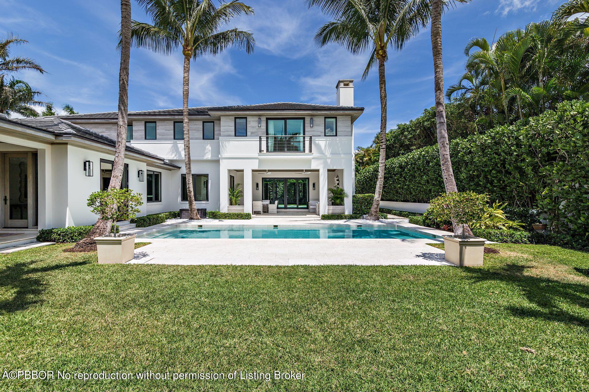 325 Garden Road Palm Beach, FL 33480 - Photo 42 of 57 a view of a house with a yard and palm trees