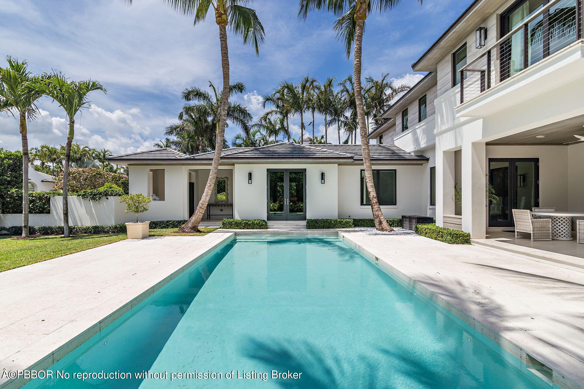 325 Garden Road Palm Beach, FL 33480 - Photo 45 of 57 a view of house with outdoor space and swimming pool