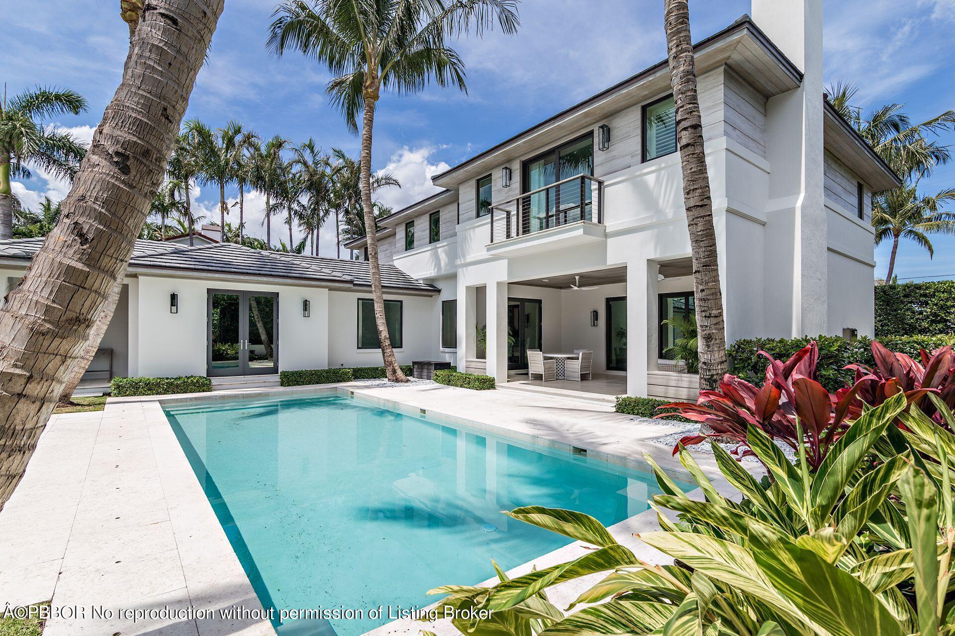 325 Garden Road Palm Beach, FL 33480 - Photo 46 of 57 front view of a house with a patio