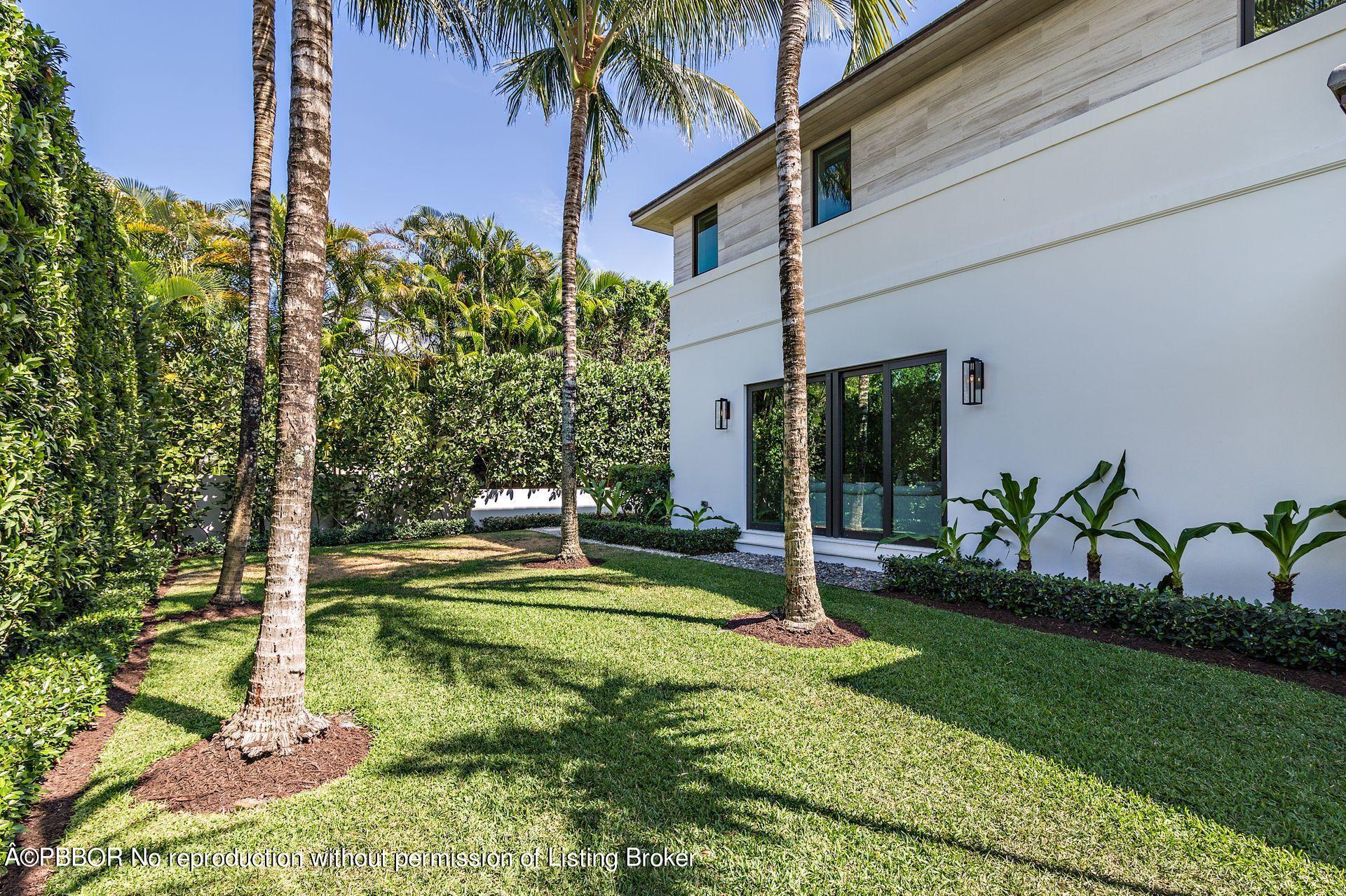 325 Garden Road Palm Beach, FL 33480 - Photo 48 of 57 a view of a house with backyard and a patio