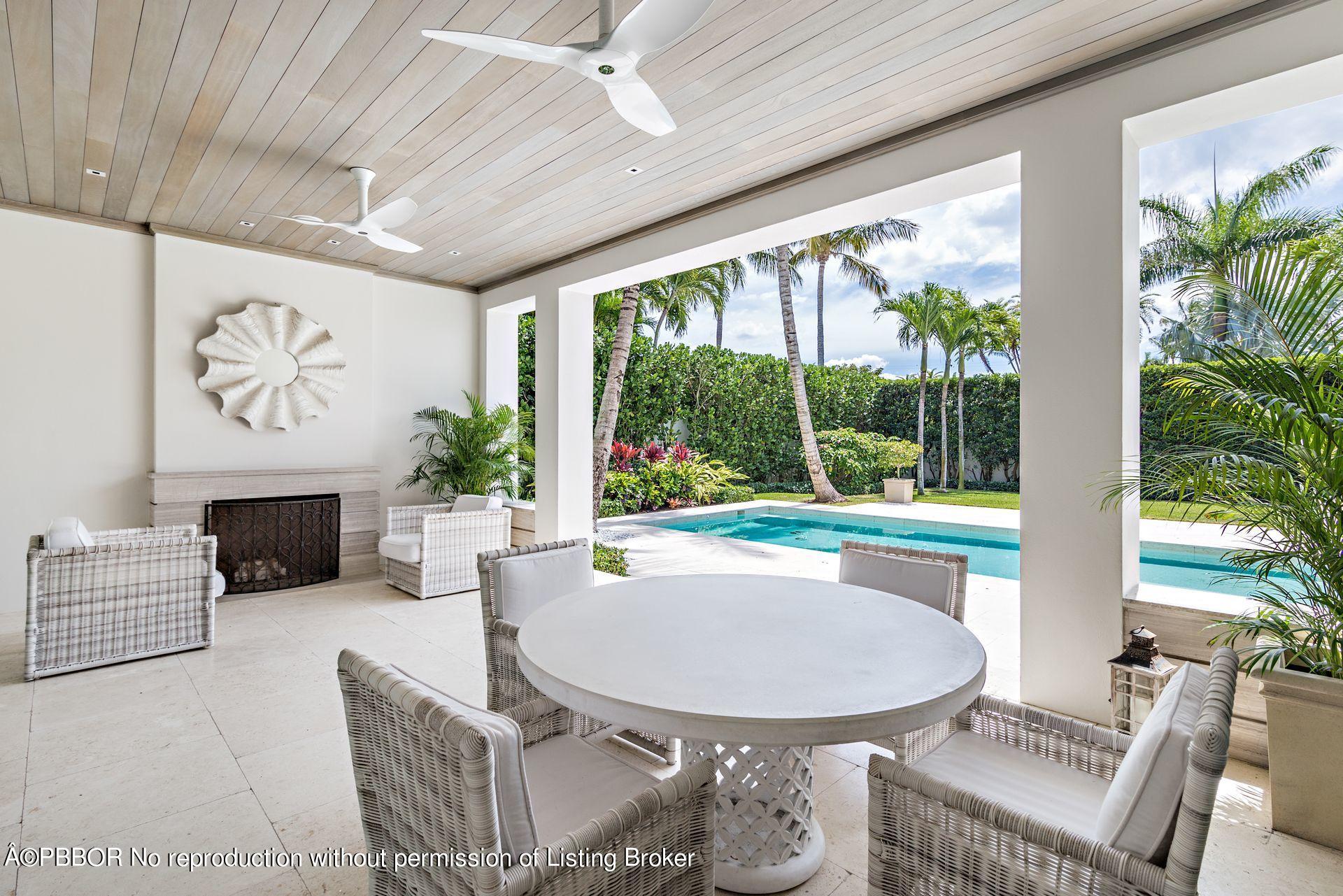 325 Garden Road Palm Beach, FL 33480 - Photo 7 of 57 a living room with furniture and a large window