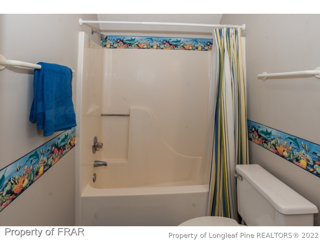 6213 Kirkwall Road Fayetteville, NC 28311 - Photo 16 of 21 a bathroom with a bathtub and a shower