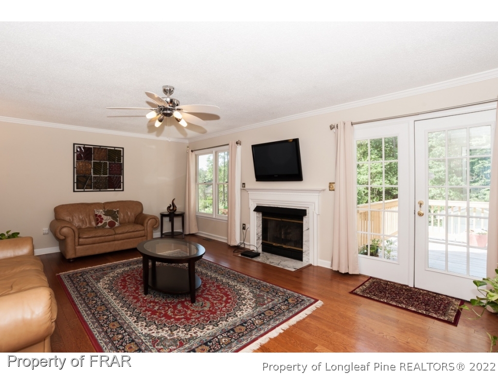 6213 Kirkwall Road Fayetteville, NC 28311 - Photo 2 of 21 a living room with furniture and a fireplace
