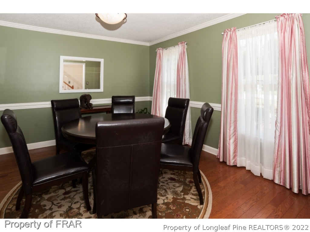6213 Kirkwall Road Fayetteville, NC 28311 - Photo 4 of 21 a view of a dining room with furniture and a window