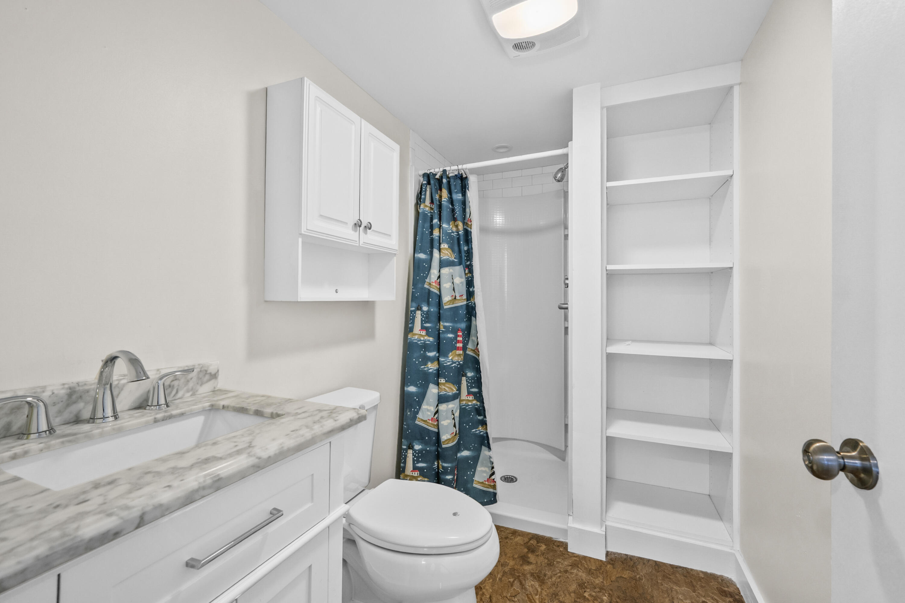 14 Brewster Road West Yarmouth, MA 02673 - Photo 11 of 17 a bathroom with a granite countertop sink toilet and shower