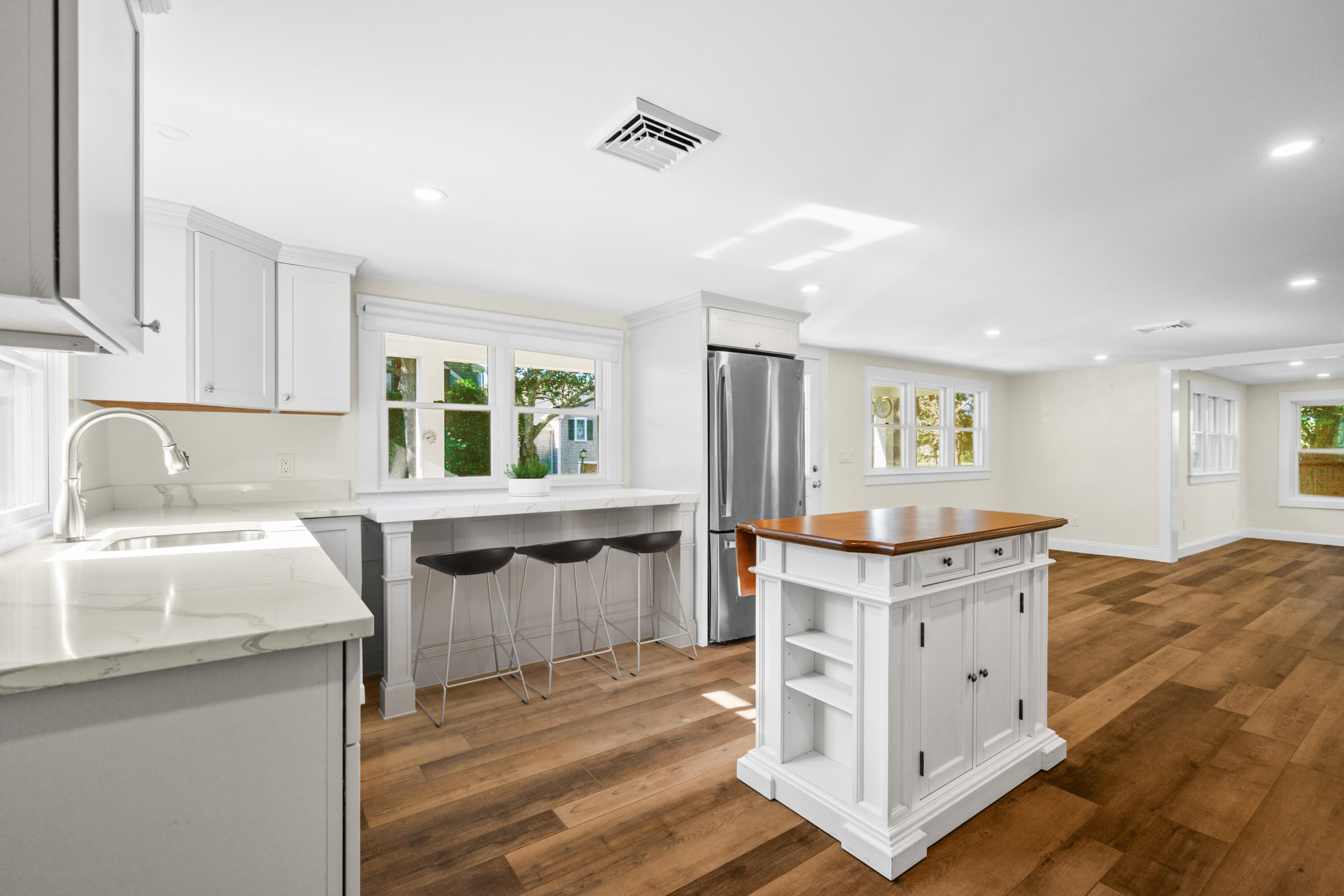 14 Brewster Road West Yarmouth, MA 02673 - Photo 6 of 17 a kitchen with granite countertop a sink stove and cabinets