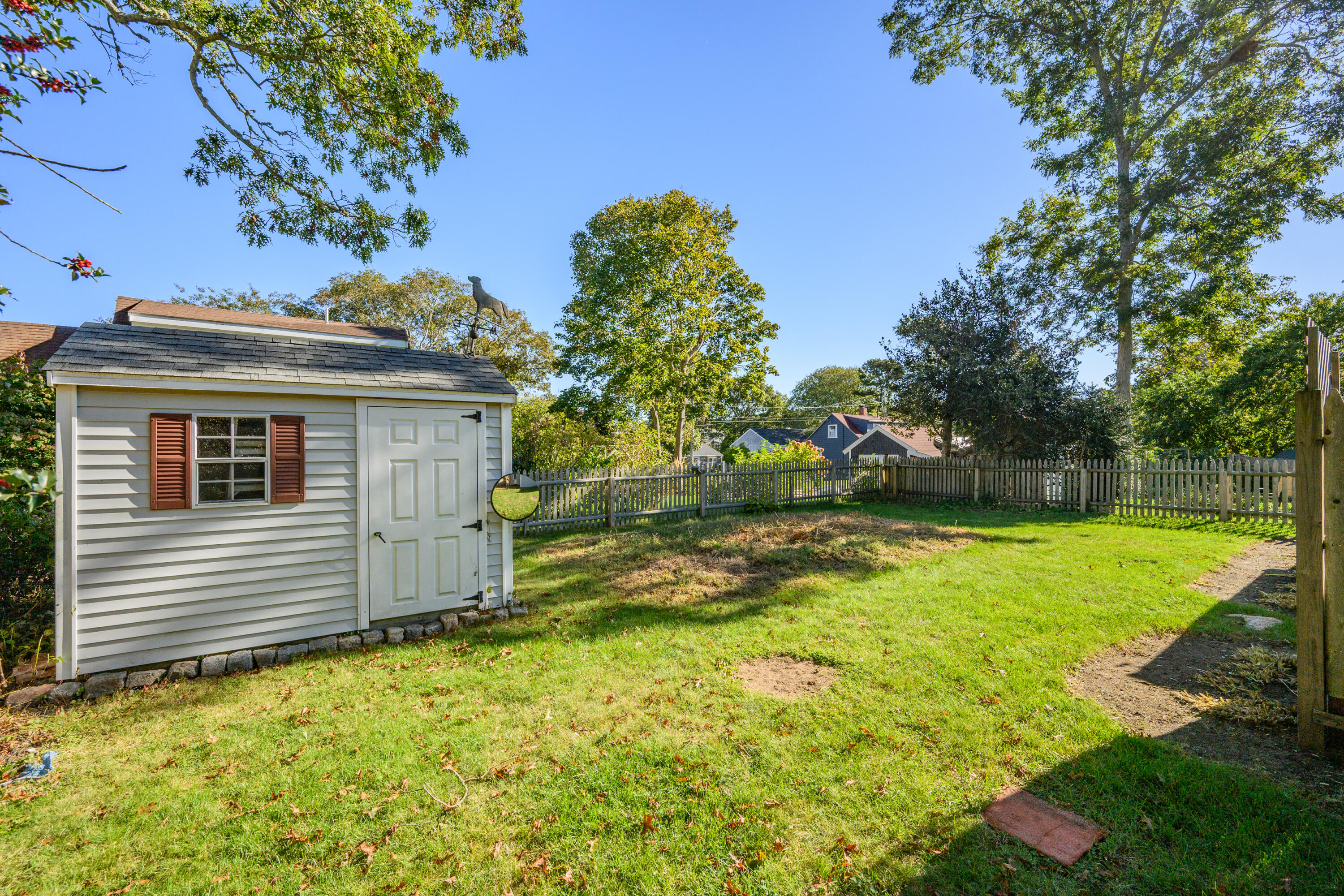 14 Brewster Road West Yarmouth, MA 02673 - Photo 10 of 17 a view of a house with a backyard