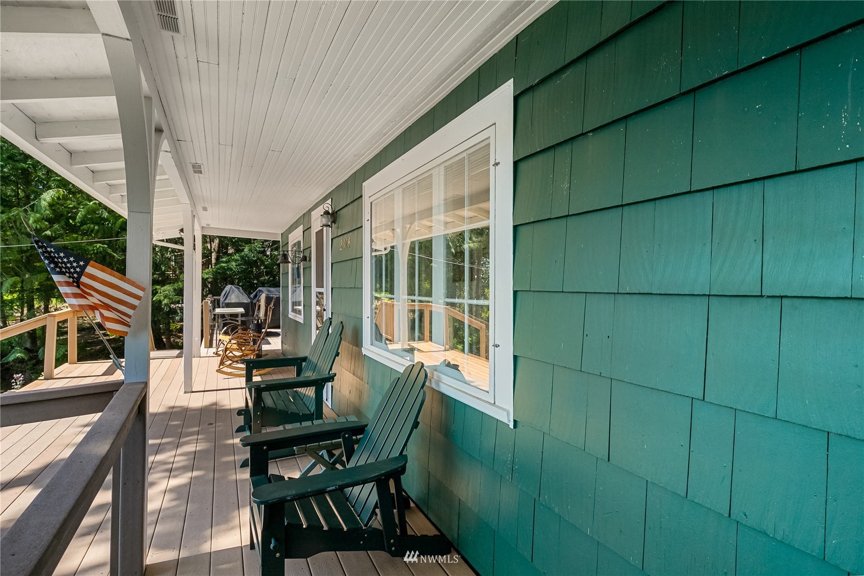 2964 North Shore Road Bellingham, WA 98226 - Photo 13 of 40 a view of a patio with table and chairs and wooden floor