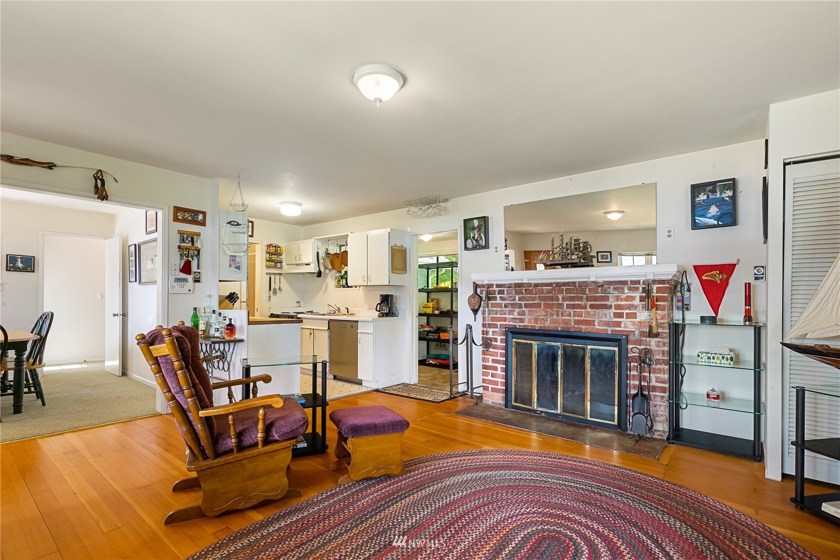 2964 North Shore Road Bellingham, WA 98226 - Photo 17 of 40 a living room with furniture and a fireplace