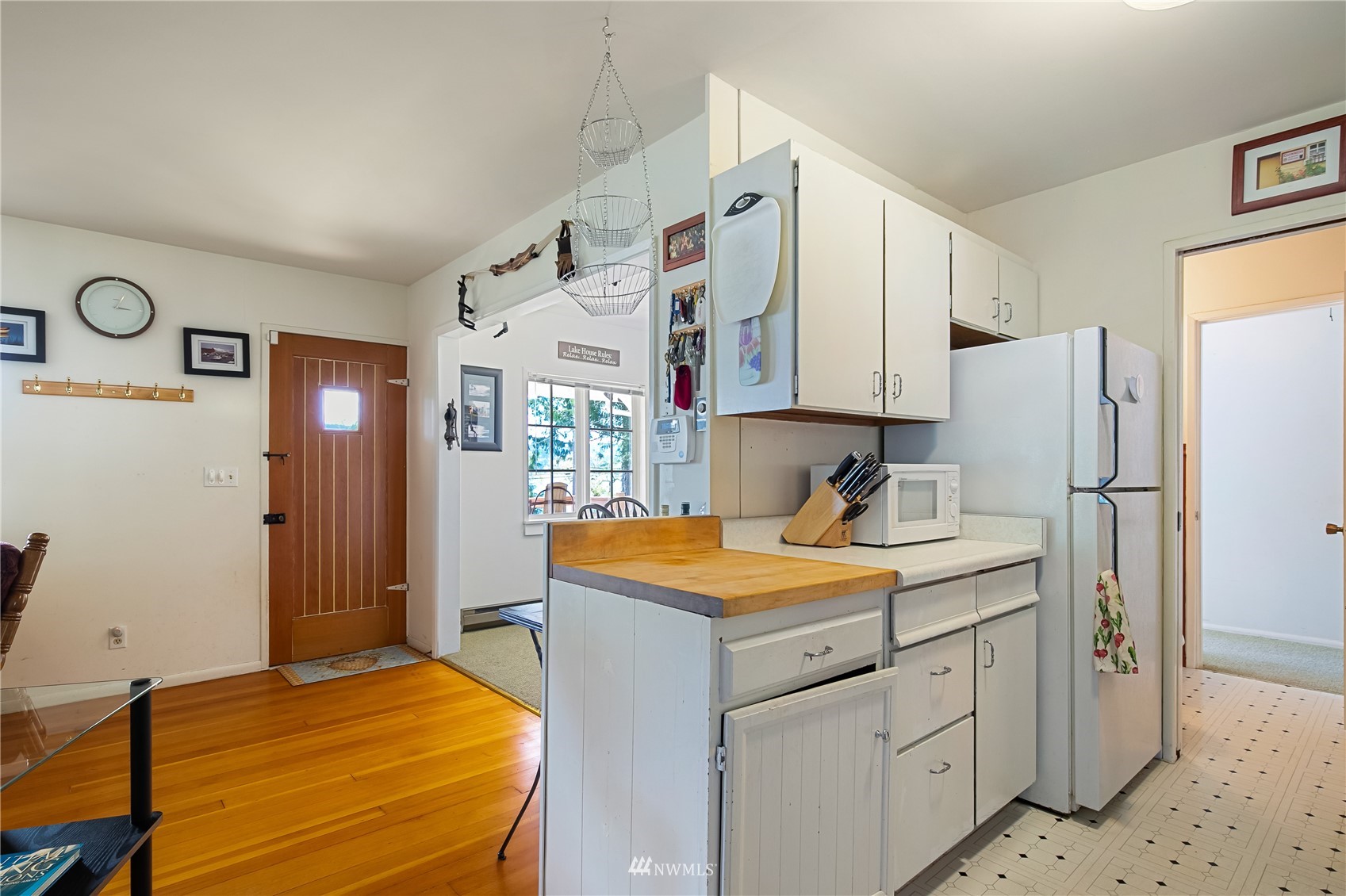 2964 North Shore Road Bellingham, WA 98226 - Photo 24 of 40 a bedroom with a bed and a refrigerator