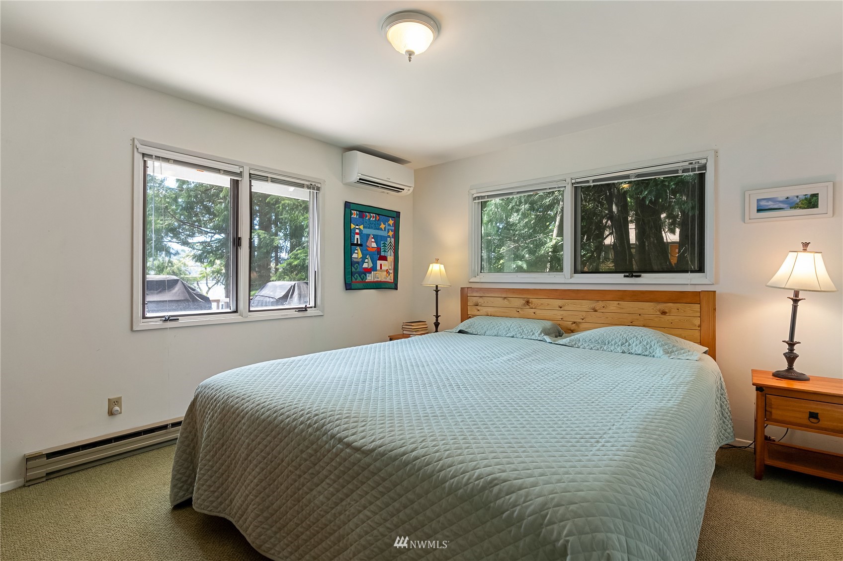 2964 North Shore Road Bellingham, WA 98226 - Photo 26 of 40 a bedroom with a bed and a lamp