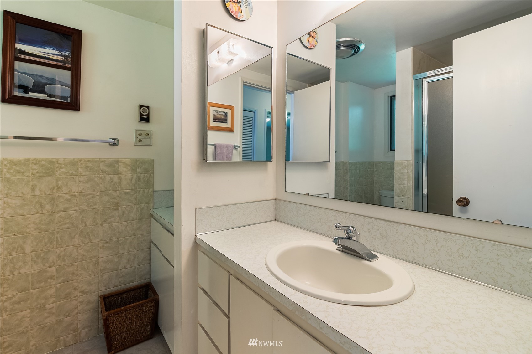 2964 North Shore Road Bellingham, WA 98226 - Photo 32 of 40 a bathroom with a sink and a mirror