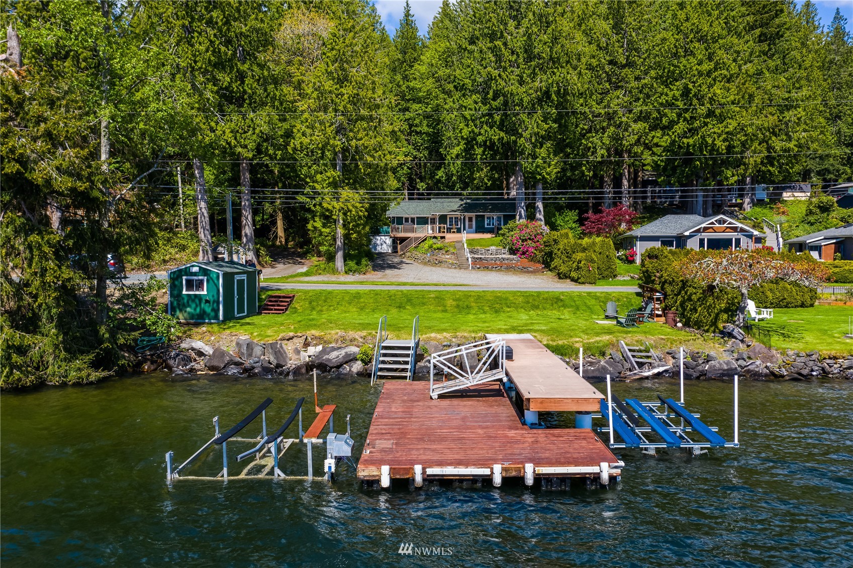 2964 North Shore Road Bellingham, WA 98226 - Photo 4 of 40 a view of a swimming pool with lawn chairs and a big yard