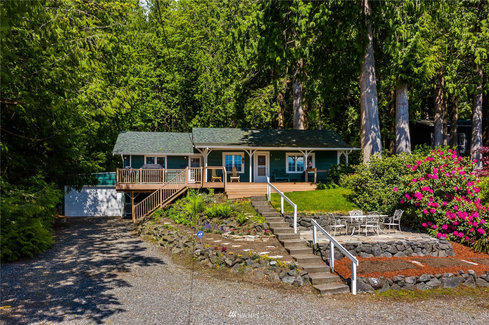 2964 North Shore Road Bellingham, WA 98226 - Photo 7 of 40 a house with lots of trees in the background