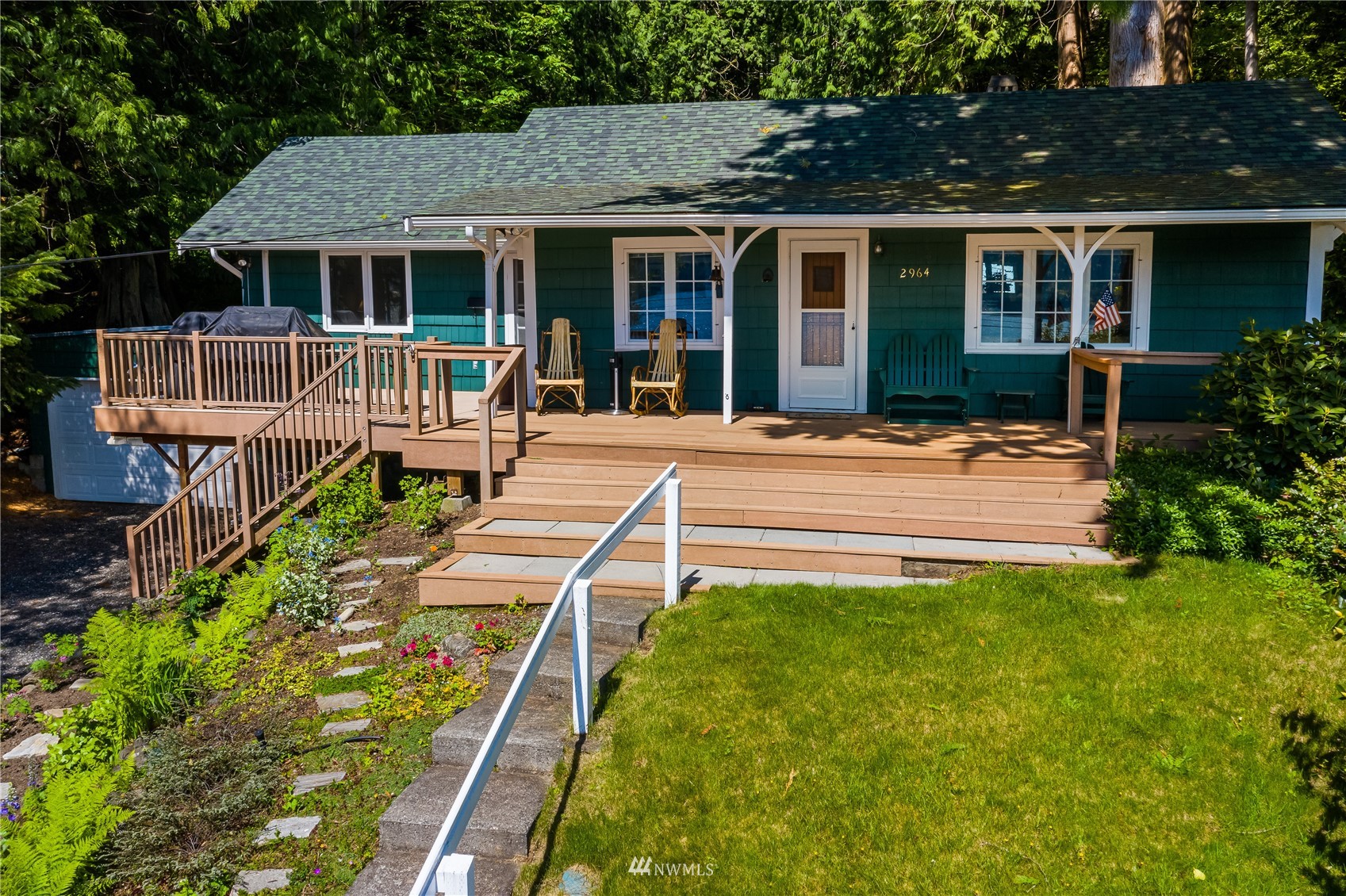 2964 North Shore Road Bellingham, WA 98226 - Photo 8 of 40 a front view of a house with yard porch and furniture