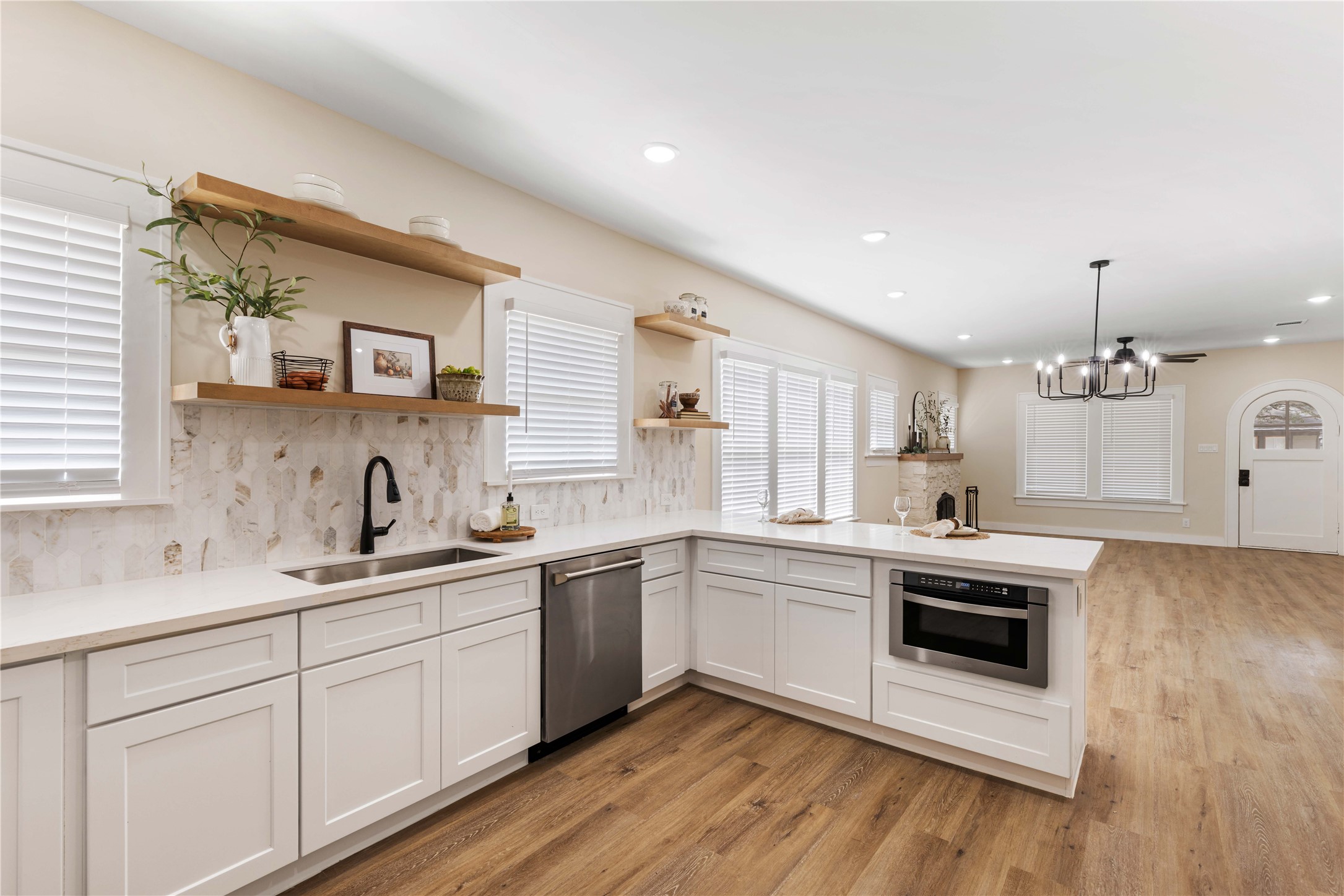 908 Key Street Houston, TX 77009 - Photo 6 of 29 Open shelving with marble backsplash and quartz countertops
