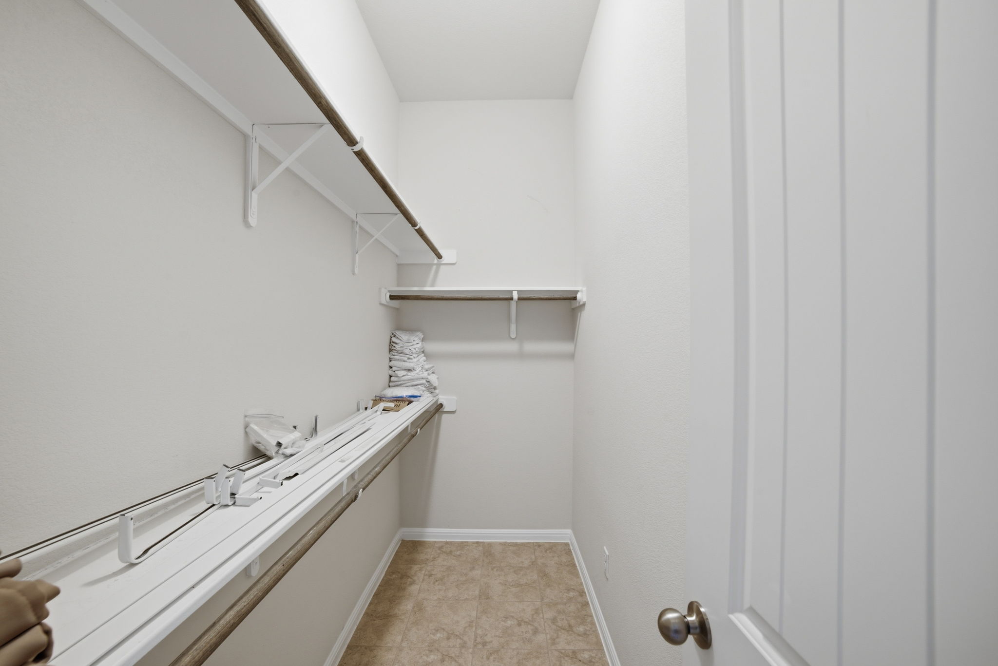 514 Nautical Loop Kyle, TX 78640 - Photo 17 of 24 Ample shelving and hanging space in this well-appointed walk-in closet.