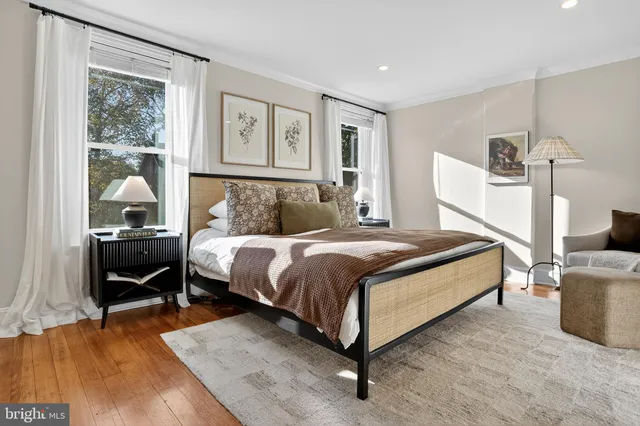 a bathroom with a granite countertop sink mirror and a shower