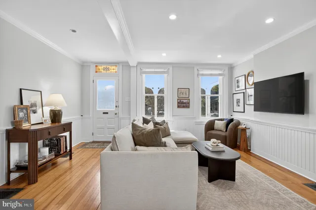 a view of a dining room with furniture and a window