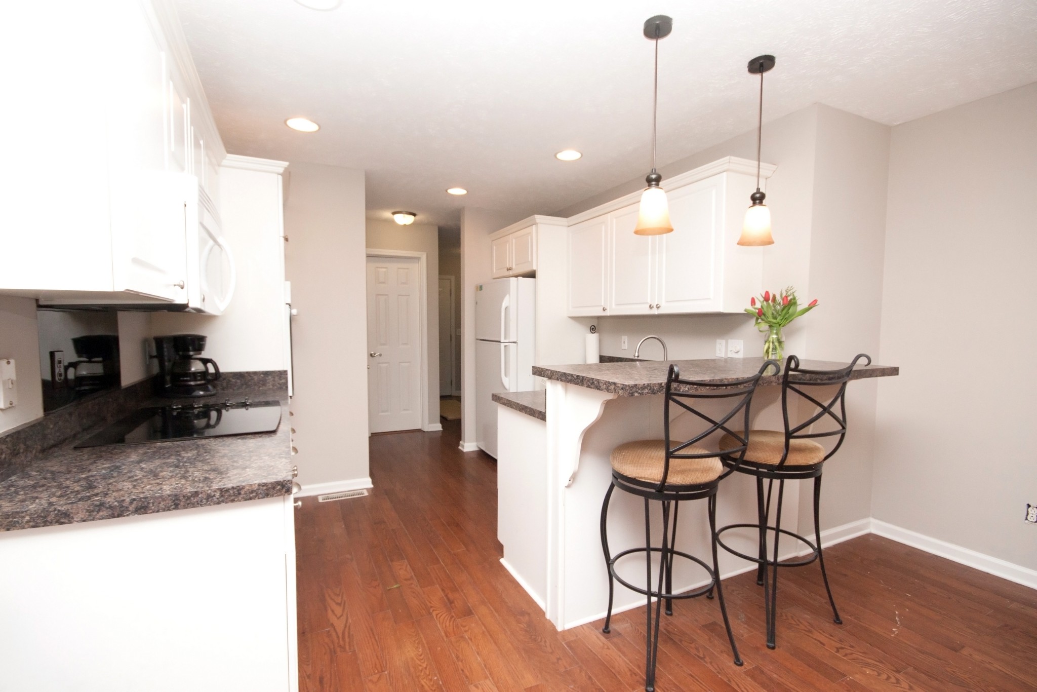 524 Windy Road Mount Juliet, TN 37122 - Photo 11 of 35 a kitchen with stainless steel appliances granite countertop a table chairs and a refrigerator