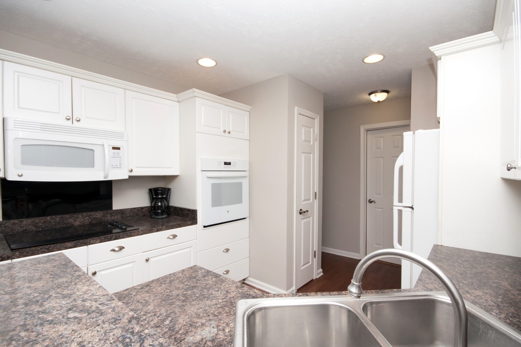 524 Windy Road Mount Juliet, TN 37122 - Photo 12 of 35 a kitchen with granite countertop a sink and white cabinets
