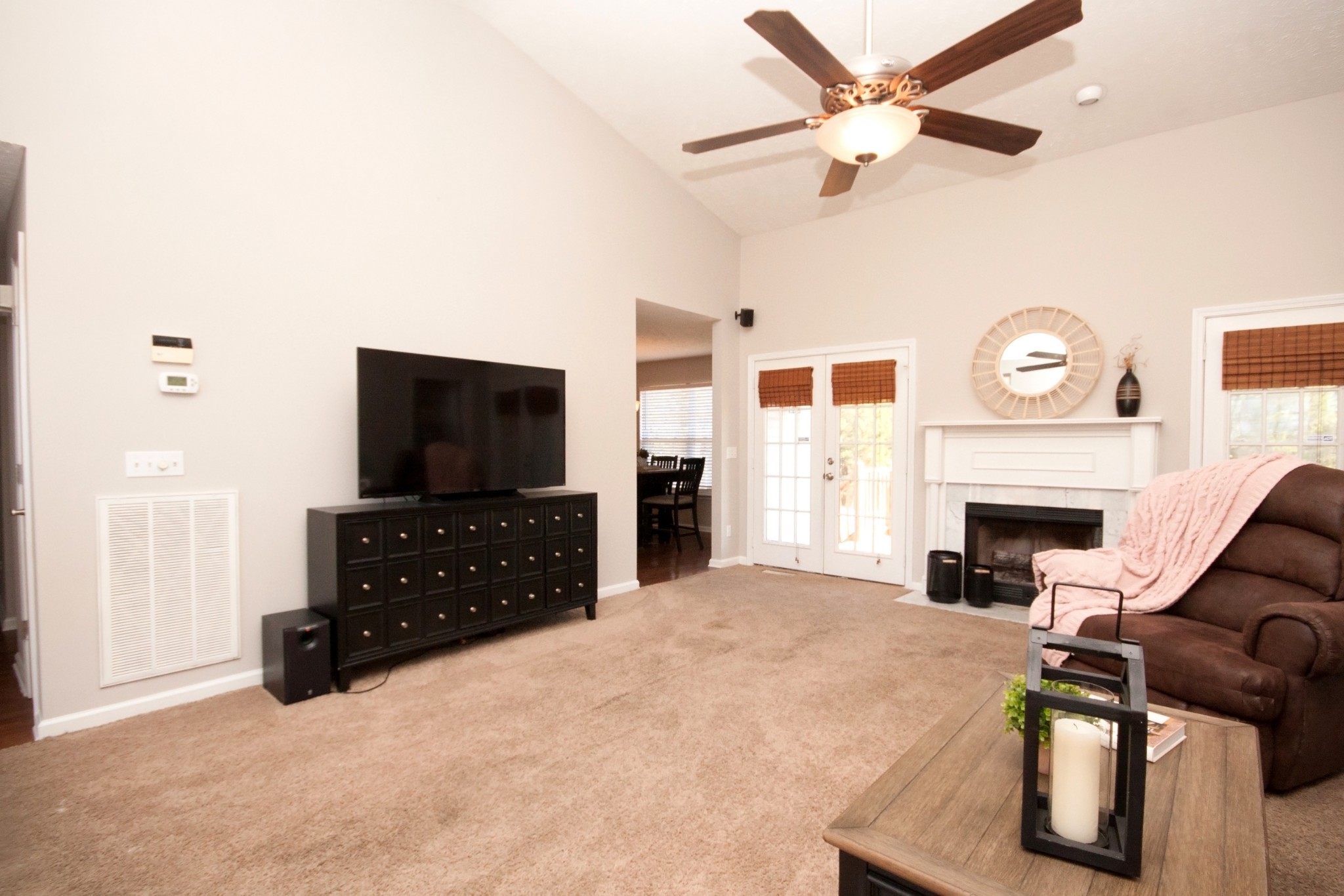 524 Windy Road Mount Juliet, TN 37122 - Photo 8 of 35 a living room with furniture a fireplace and a flat screen tv