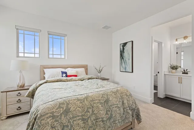 a bathroom with a sink a mirror a glass door a shower and a bathtub