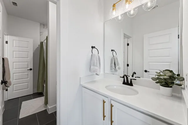 a work room with furniture and a bookshelf