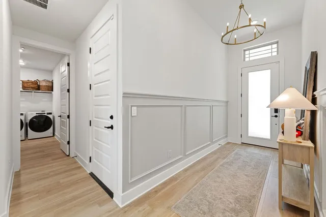 a kitchen with a sink refrigerator and wooden cabinets
