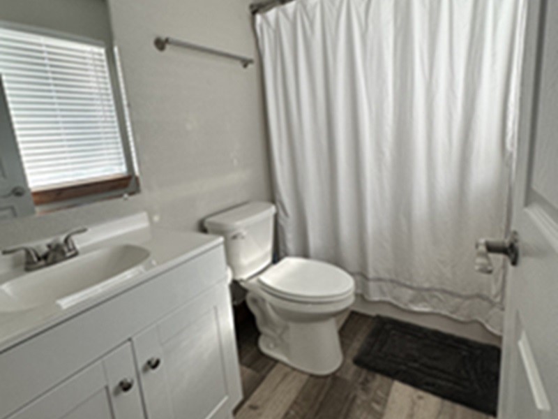 4326 Highway 19 Trinity, TX 75862 - Photo 12 of 12 a bathroom with a sink toilet and shower