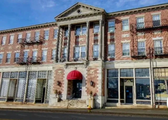 a front view of a building with glass windows