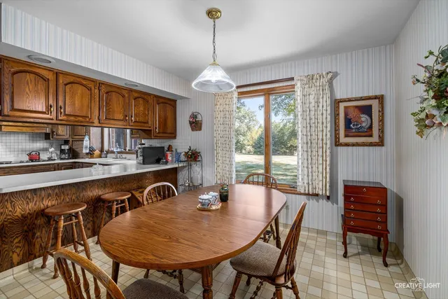 a bathroom with a sink toilet and a window